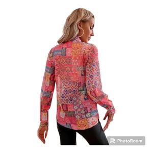 Bohemian patchwork long sleeve blouse top in corals and orange colors. Size L.